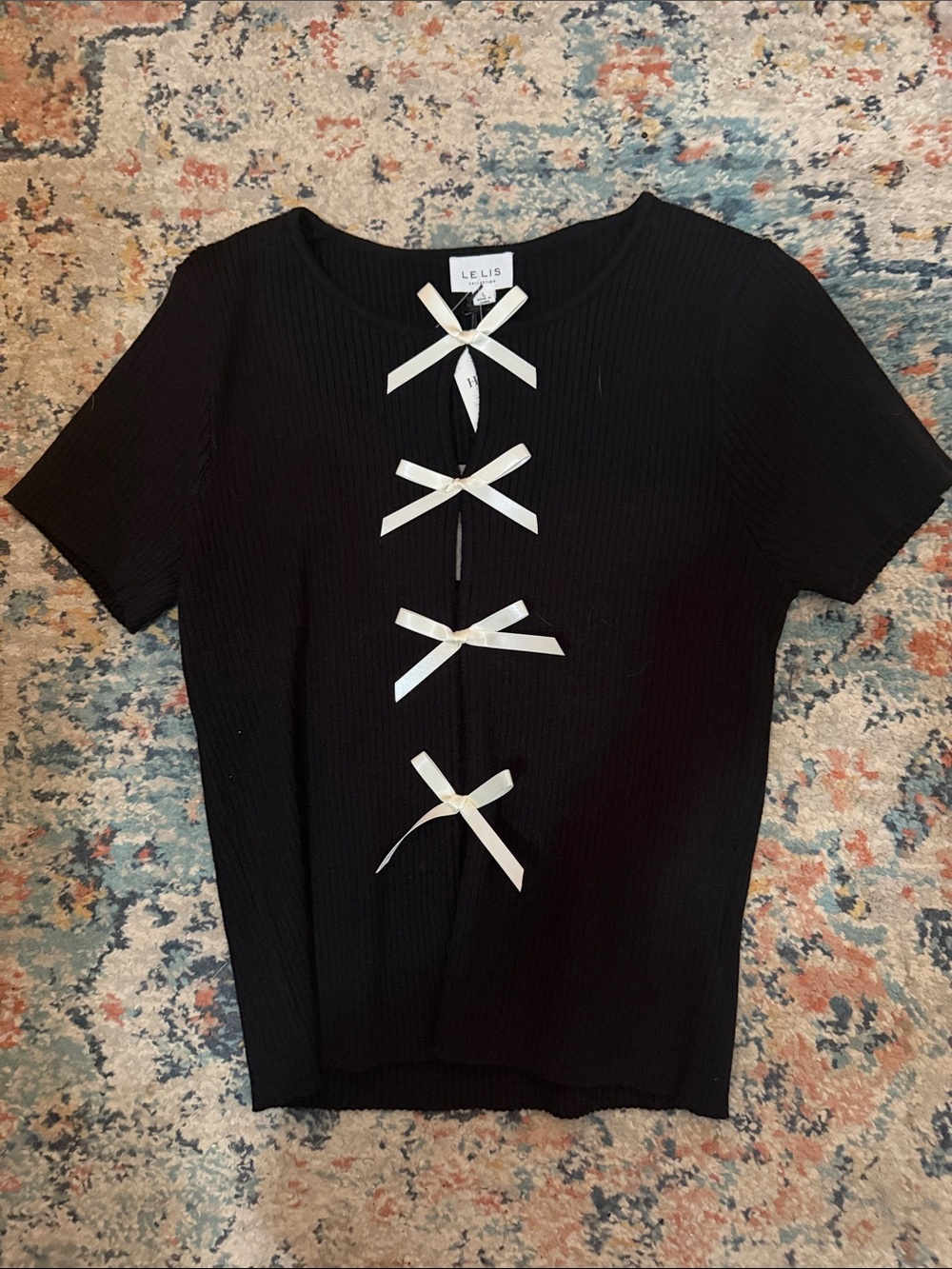 Le Lis Black Short Sleeve Ribbed Top with Ivory Bow Accents